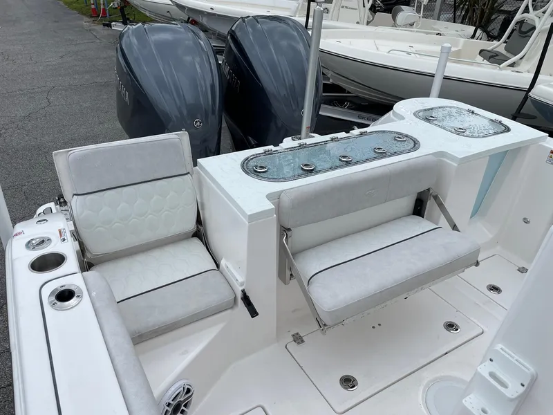 Slide: The Image of 2024 Sea Fox 288 Commander boat interior with dual engines and seating area. - 15