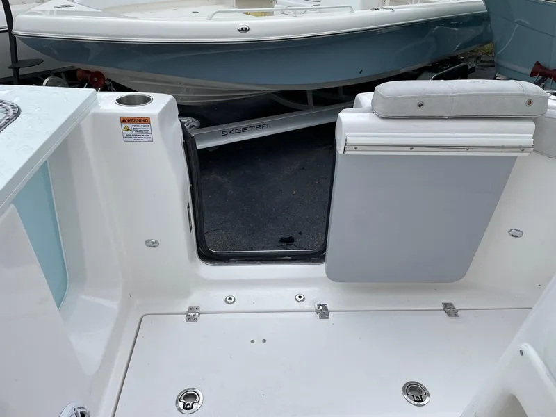 Slide: The Image of 2024 Sea Fox 288 Commander boat interior with open transom door. - 19
