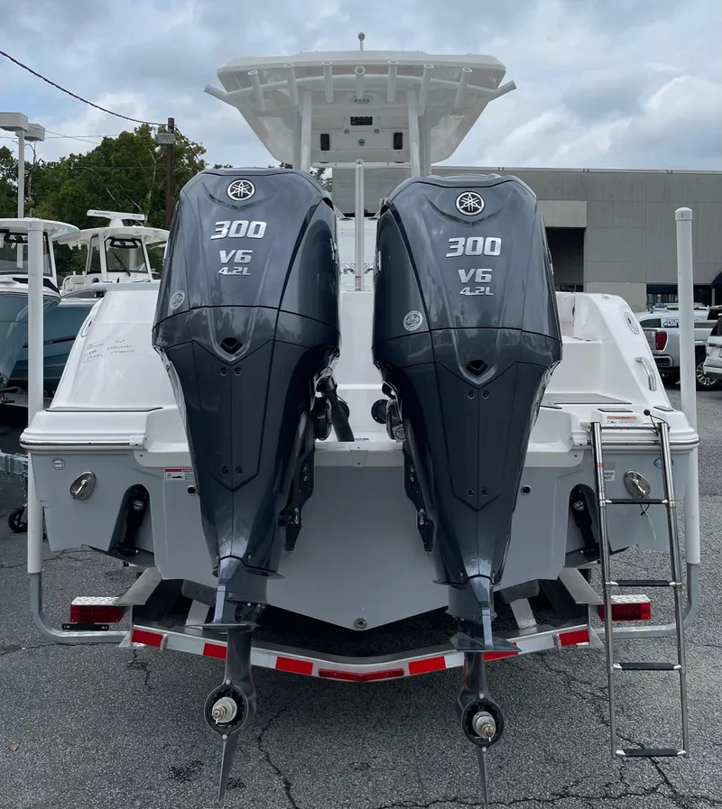Slide: The Image of 2024 Sea Fox 288 Commander with twin Yamaha 300 V6 engines, rear view. - 3