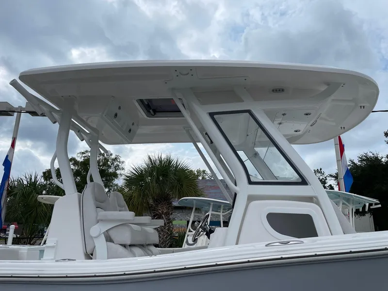 Slide: The Image of 2024 Sea Fox 288 Commander boat with sleek design and modern features under a cloudy sky. - 4