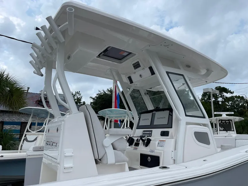 Slide: The Image of 2024 Sea Fox 288 Commander boat with modern helm and dual displays. - 6