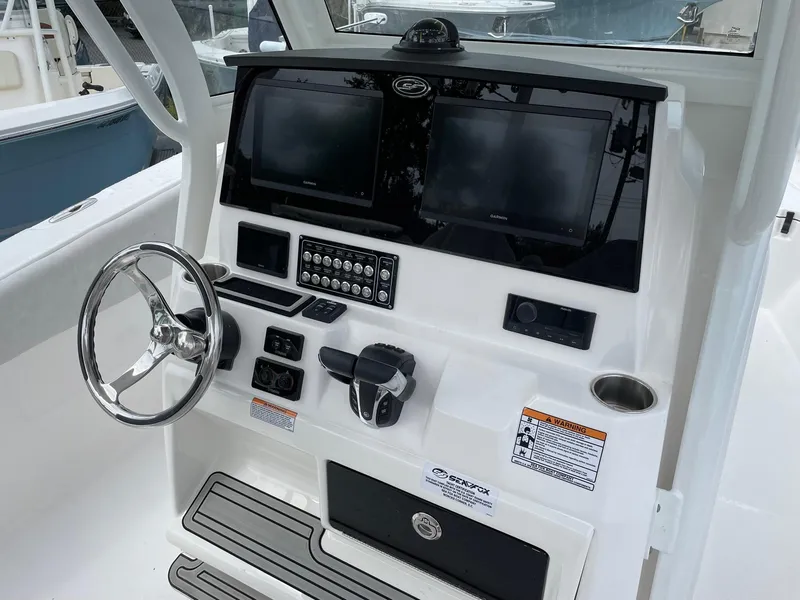 Slide: The Image of 2024 Sea Fox 288 Commander helm with dual screens and modern controls. - 8