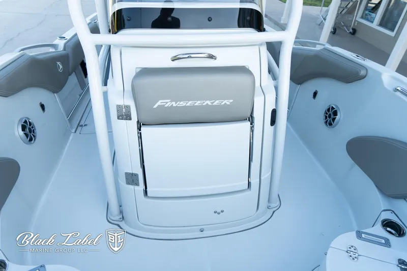 Slide: The Image of 2024 Finseeker 230 boat interior with seating and storage, by Black Label Marine Group. - 14