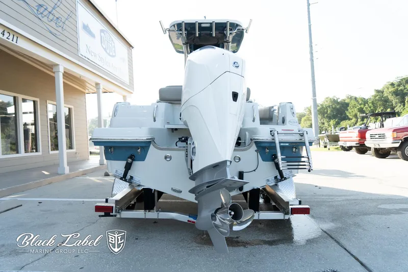 Slide: The Image of 2024 Finseeker 230 FinSeeker boat on trailer, rear view, outside dealership. - 9