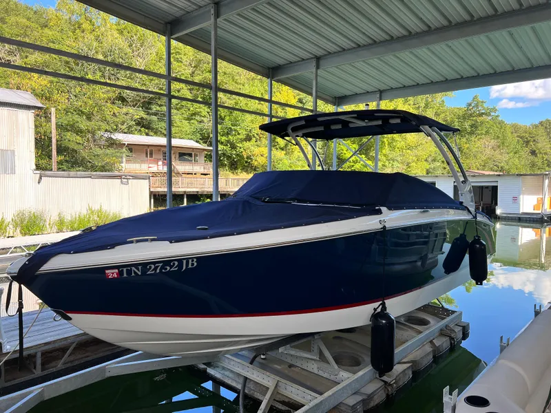 The Image of 2021 Cobalt R5 boat docked under a covered marina. - 0