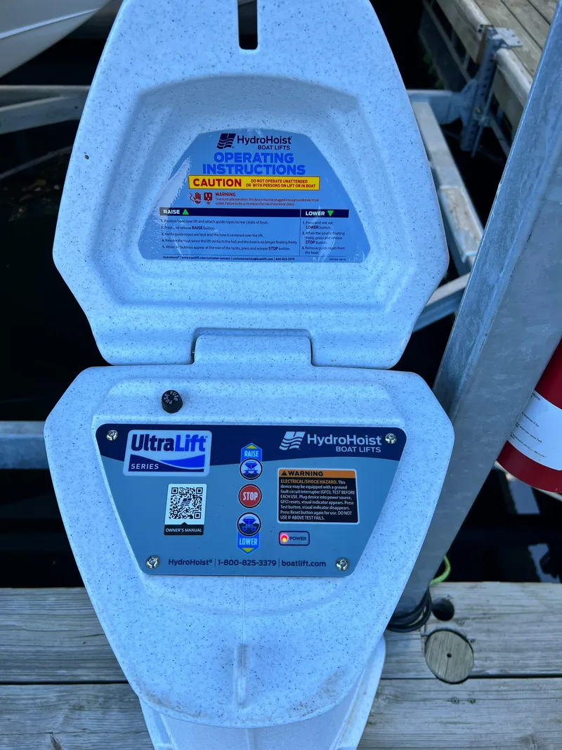 Slide: The Image of HydroHoist UltraLift boat lift control panel with operating instructions and caution labels. - 19