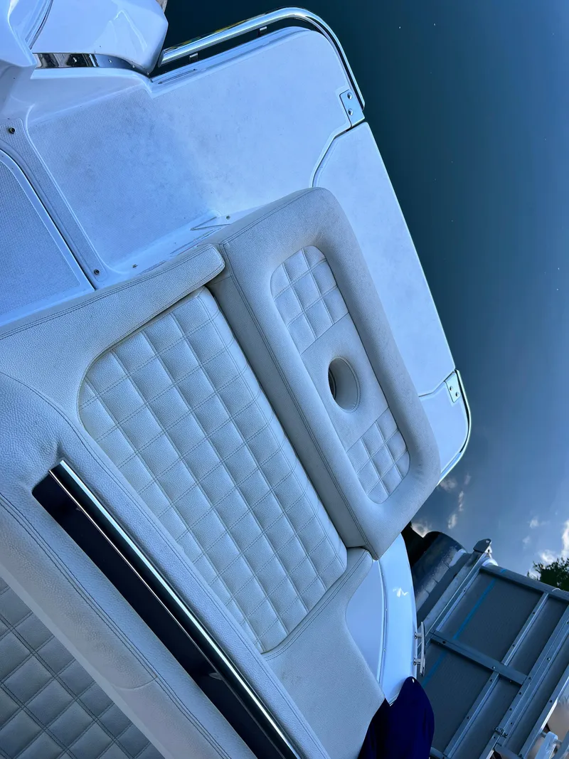 Slide: The Image of 2021 Cobalt R5 boat with white cushioned seating and stainless steel railing. - 24