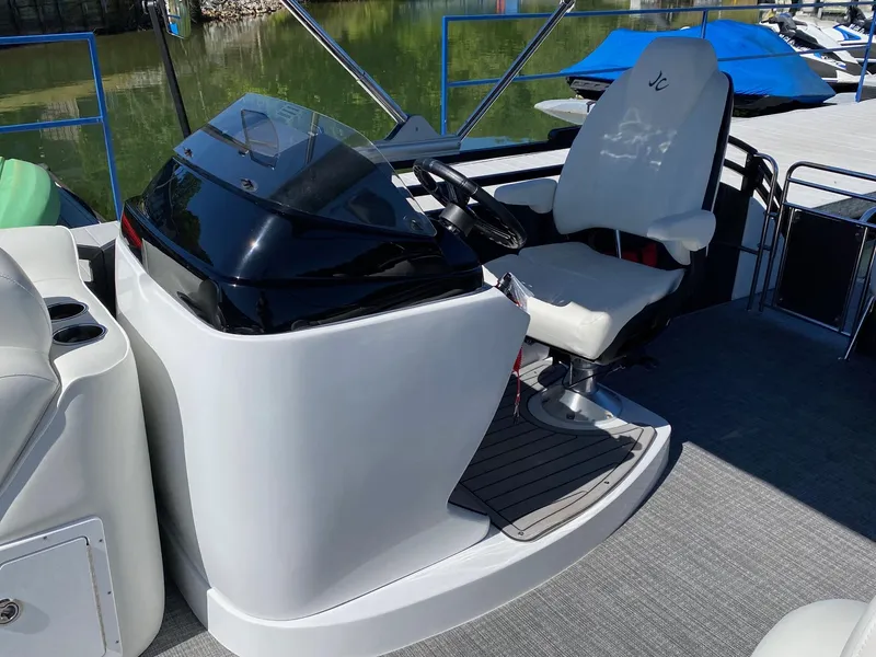 Slide: The Image of 2023 JC Neptoon Sport 23TT boat helm with captain's chair and control console. - 12