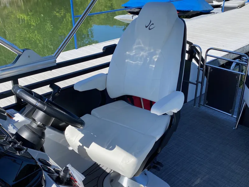 Slide: The Image of Captain's chair on a 2023 JC Neptoon Sport 23TT pontoon boat. - 13