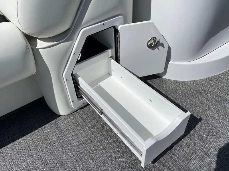Slide: The Image of 2023 JC Neptoon Sport 23TT boat storage compartment with open drawer. - 7