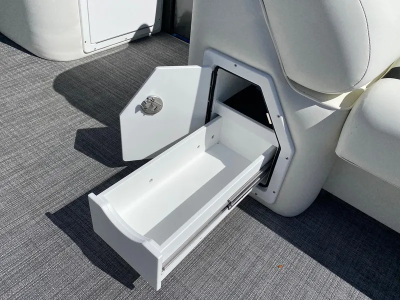 Slide: The Image of 2023 JC Neptoon Sport 23TT storage compartment with pull-out drawer. - 8
