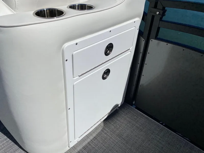 Slide: The Image of 2023 JC Neptoon Sport 23TT boat interior storage compartment with cup holders. - 9