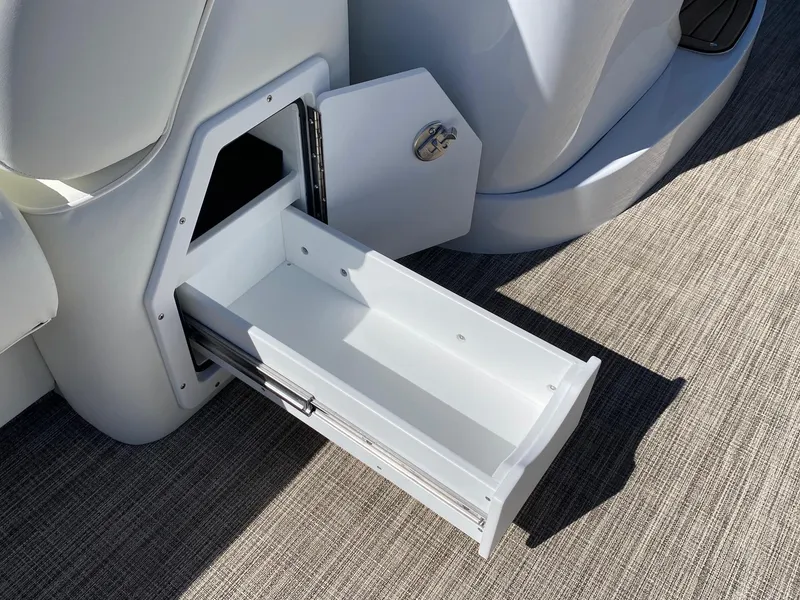 Slide: The Image of 2024 JC NEPTOON SPORT 21TT boat storage compartment with open drawer. - 8