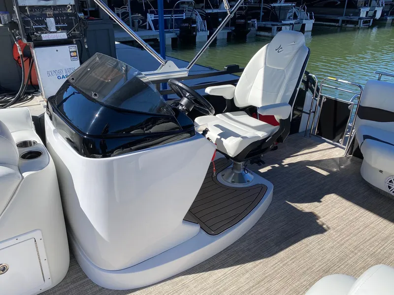Slide: The Image of 2024 JC NEPTOON SPORT 21TT boat helm with captain's chair and control console. - 9