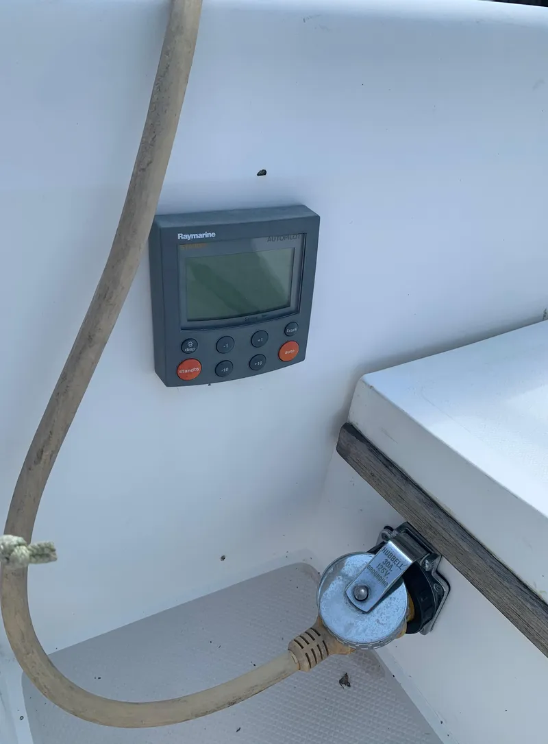 Slide: The Image of Raymarine display and power socket on a 1987 Catalina 30 Tall-Rig sailboat. - 11