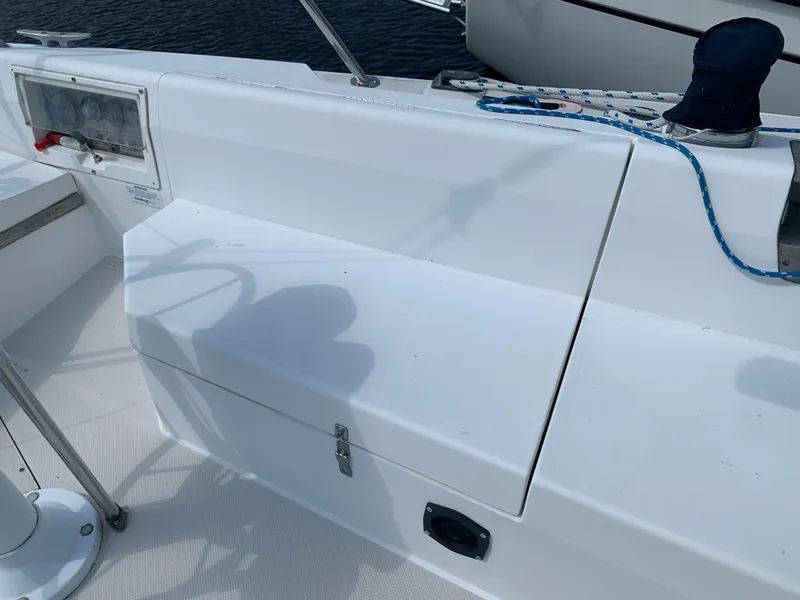 Slide: The Image of Cockpit of 1987 Catalina 30 Tall-Rig sailboat with storage compartments and control panel. - 17