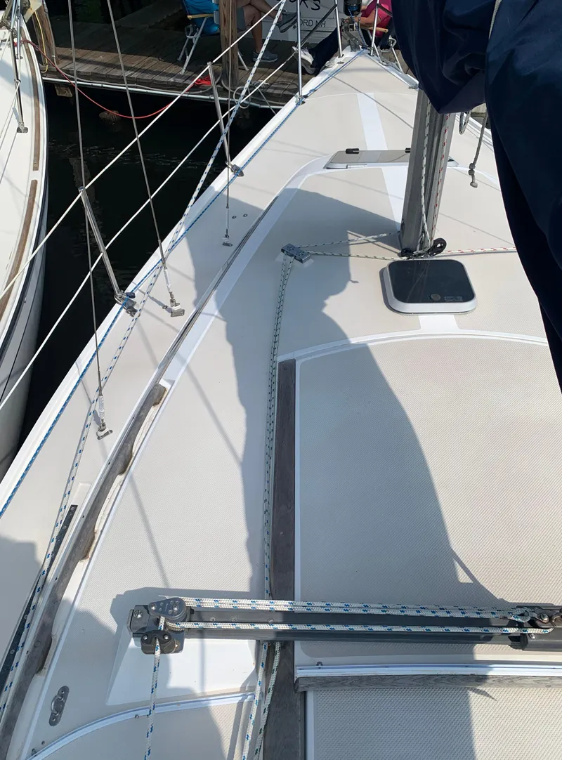 Slide: The Image of 1987 Catalina 30 Tall-Rig sailboat deck with rigging and hatch. - 20
