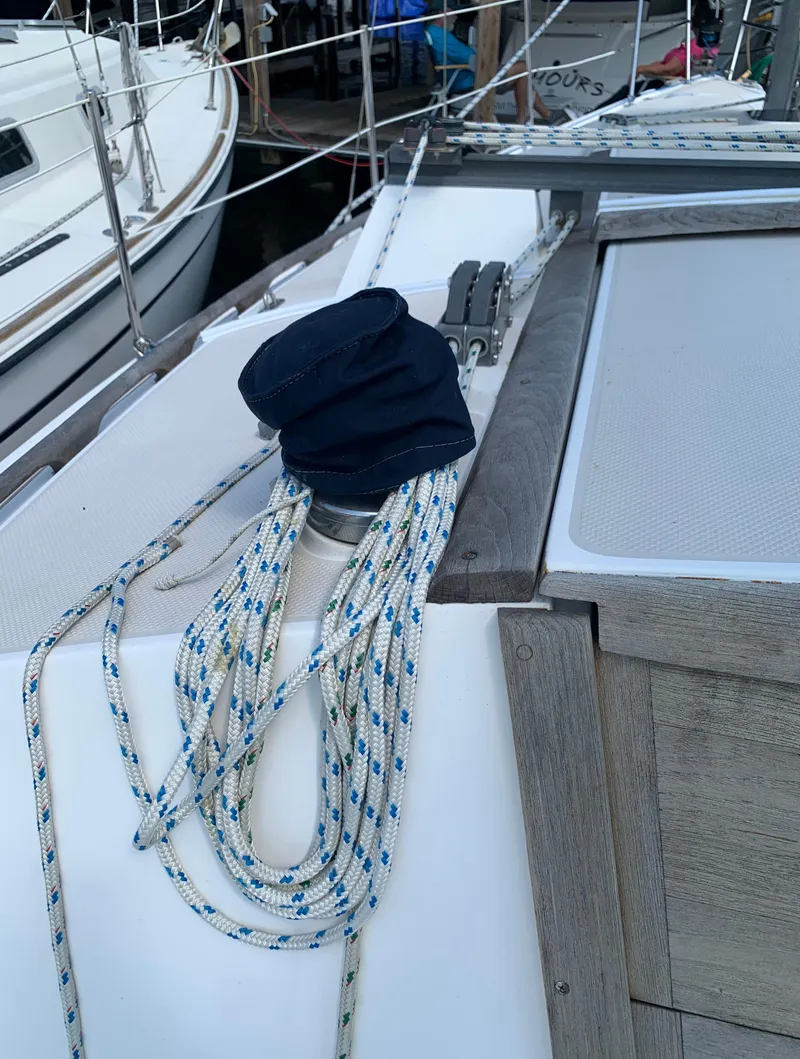 Slide: The Image of Close-up of 1987 Catalina 30 Tall-Rig sailboat deck with ropes and winch. - 23
