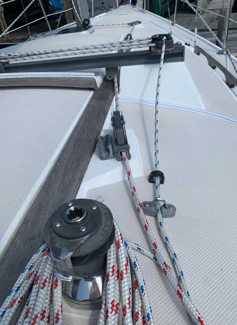 Slide: The Image of Close-up of 1987 Catalina 30 Tall-Rig sailboat deck with winch and ropes. - 24