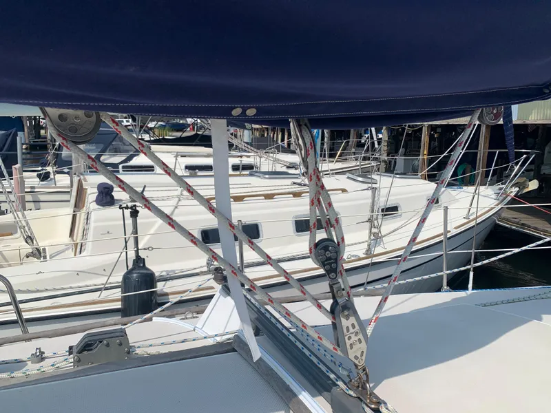Slide: The Image of 1987 Catalina 30 Tall-Rig sailboat docked at a marina. - 28