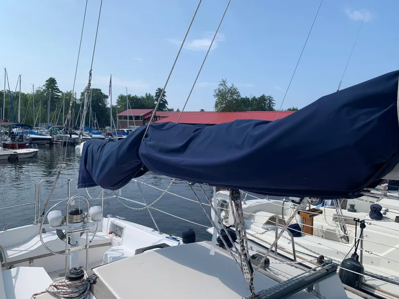 Slide: The Image of Catalina 30 Tall-Rig 1987 sailboat docked at a marina with covered mainsail. - 29