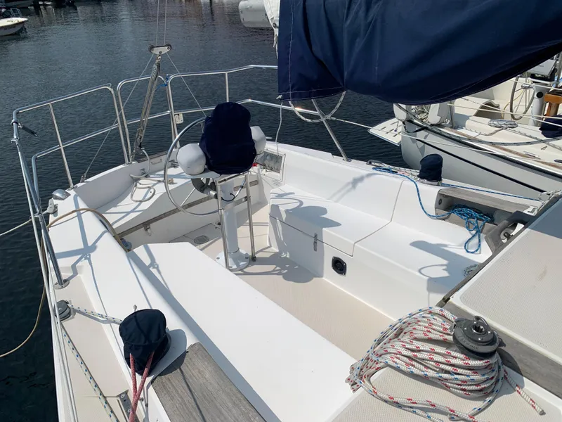 Slide: The Image of 1987 Catalina 30 Tall-Rig sailboat cockpit with steering wheel and seating. - 5