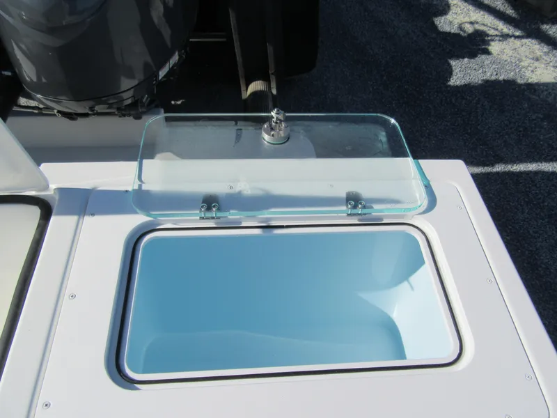 Slide: The Image of Open storage compartment on 2024 Parker 2820 XLD Sport Cabin boat. - 10