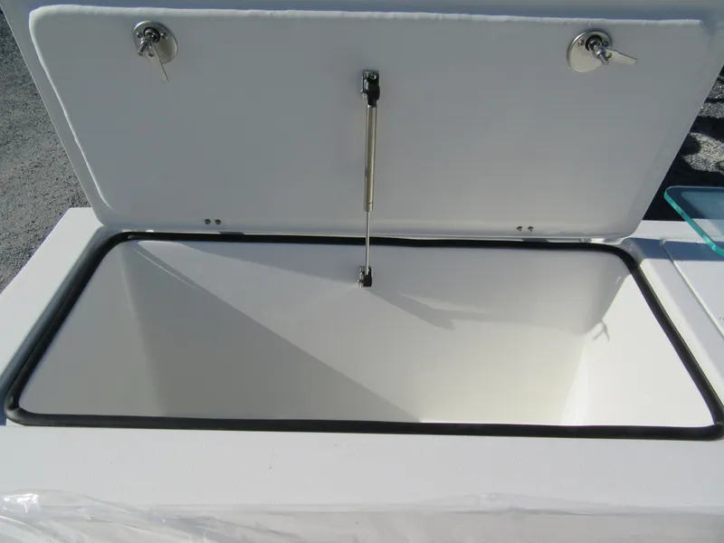 Slide: The Image of Open storage compartment on 2024 Parker 2820 XLD Sport Cabin boat. - 11