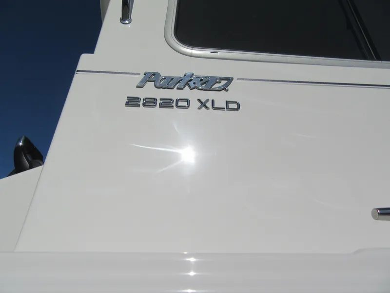 Slide: The Image of 2024 Parker 2820 XLD Sport Cabin boat exterior with model name. - 13