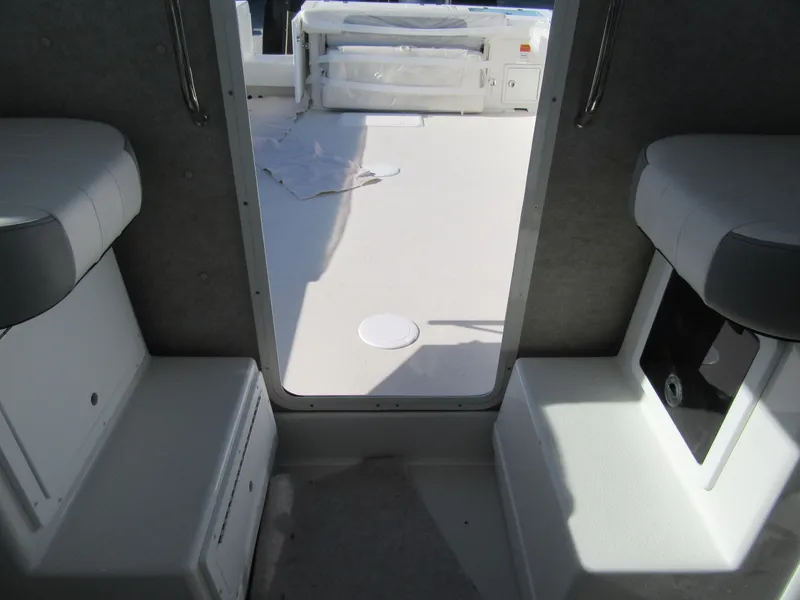 Slide: The Image of Interior view of 2024 Parker 2820 XLD Sport Cabin, showing seating and deck. - 7