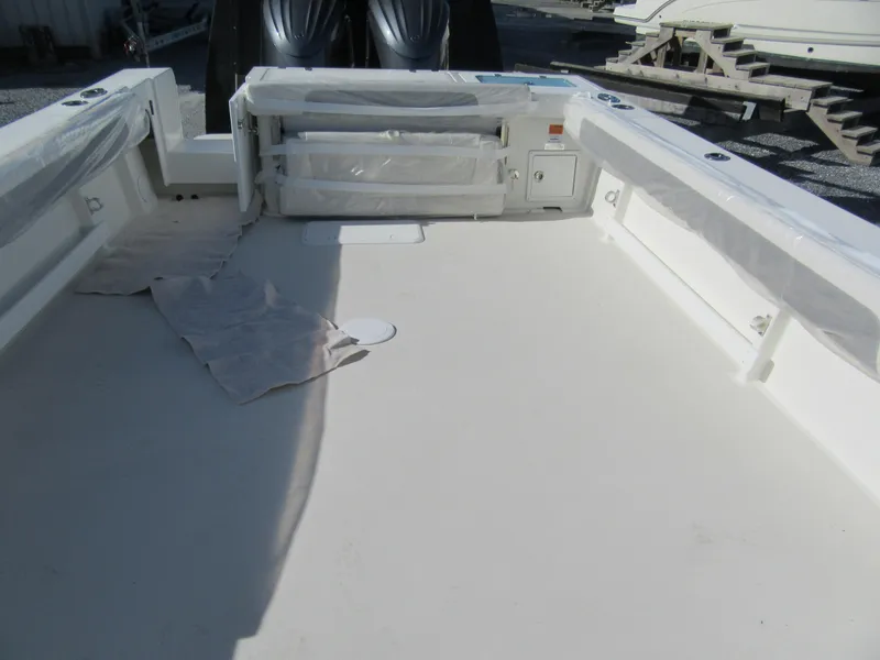 Slide: The Image of 2024 Parker 2820 XLD Sport Cabin boat deck with twin outboard engines. - 8