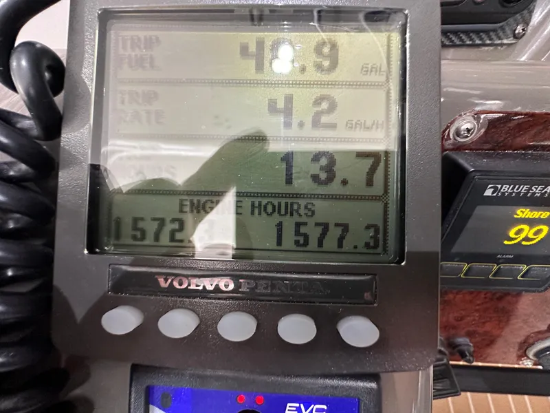 Slide: The Image of Volvo Penta engine display on a 2007 Regal 4460 Commodore boat showing fuel and engine hours. - 19