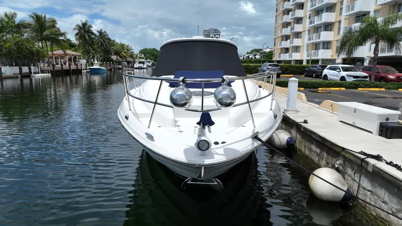 Slide: The Image of 2007 Regal 4460 Commodore yacht docked at marina with waterfront view. - 2
