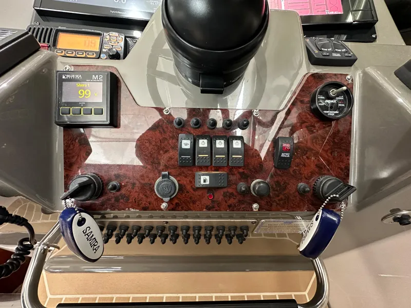 Slide: The Image of Control panel of a 2007 Regal 4460 Commodore boat with various switches and gauges. - 20