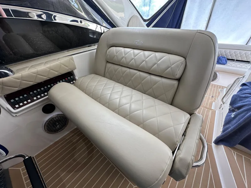 Slide: The Image of 2007 Regal 4460 Commodore boat interior with beige leather seating. - 22