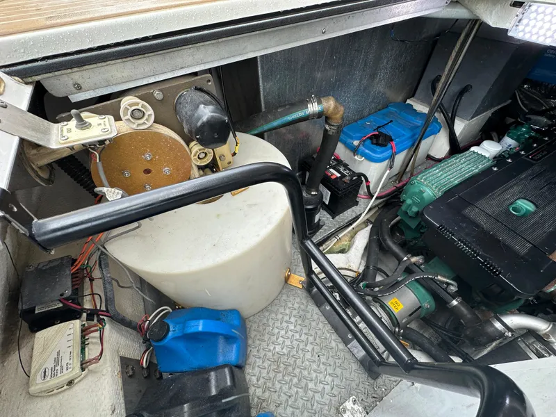 Slide: The Image of Engine compartment of a 2007 Regal 4460 Commodore boat with various components. - 24