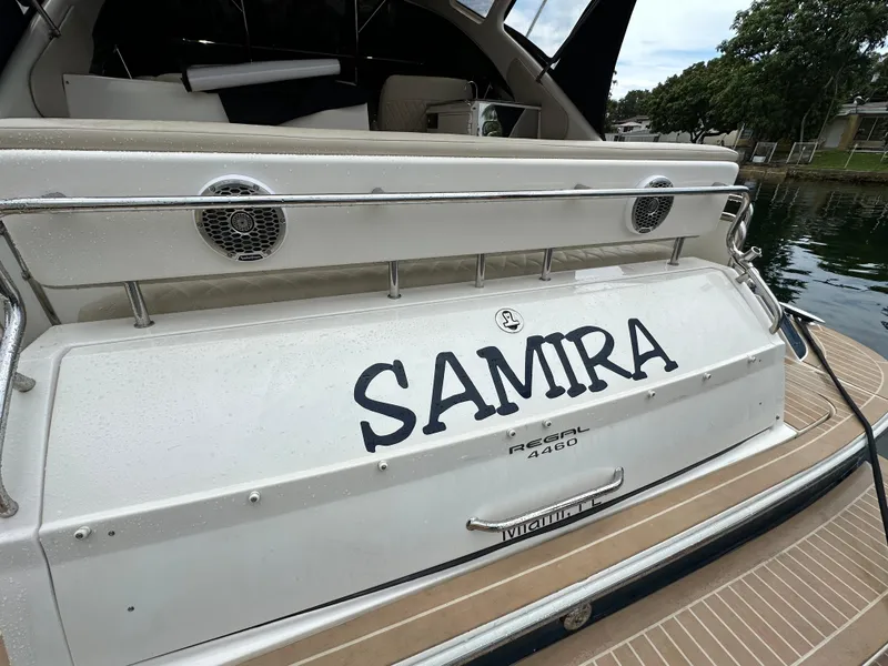 Slide: The Image of 2007 Regal 4460 Commodore yacht named Samira docked by the water. - 27