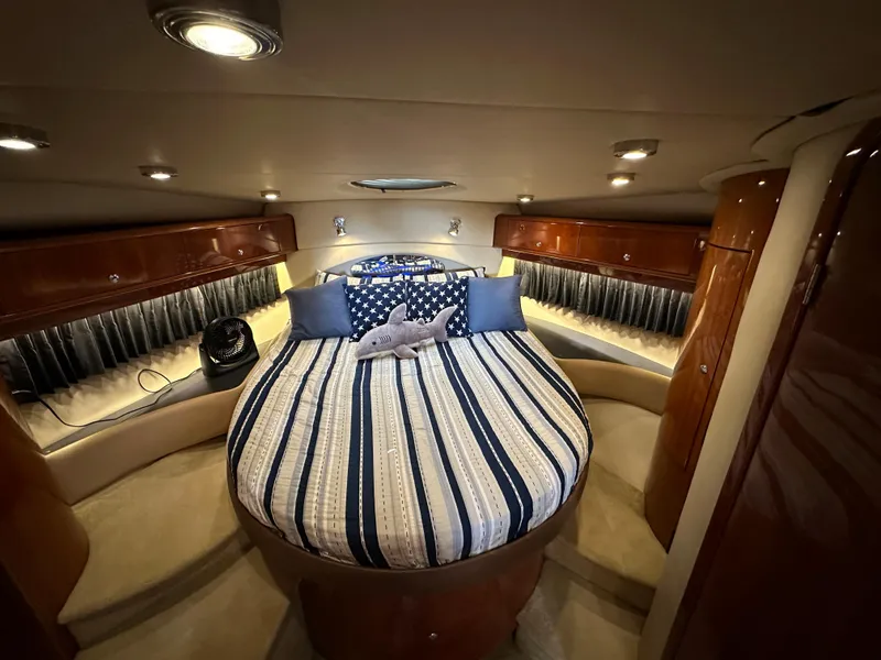 Slide: The Image of Luxurious cabin interior of a 2007 Regal 4460 Commodore yacht with a cozy bed. - 41
