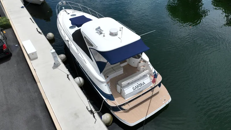 Slide: The Image of 2007 Regal 4460 Commodore yacht docked at marina. - 6