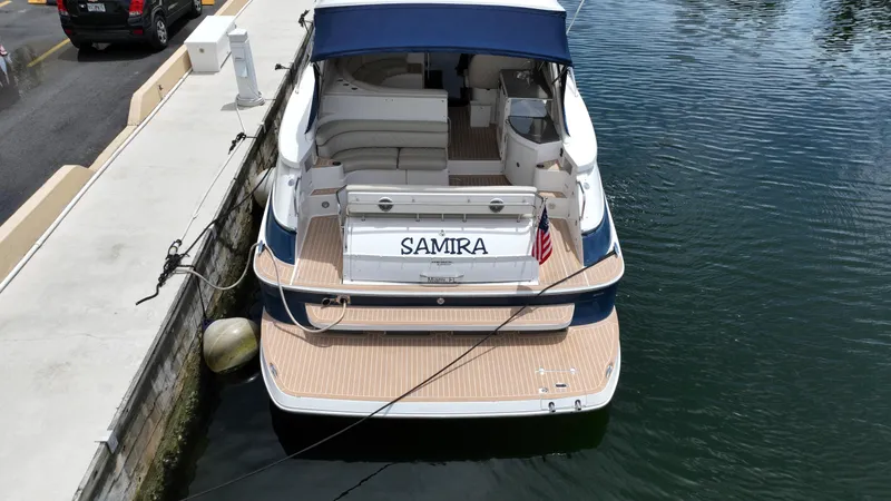 Slide: The Image of 2007 Regal 4460 Commodore yacht docked at marina, rear view. - 8