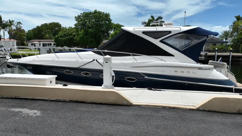 Slide: The Image of 2007 Regal 4460 Commodore yacht docked at marina. - 9