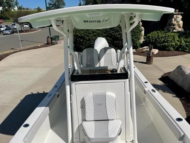 Slide: The Image of 2024 Ranger 2510 Bay boat with white seating and T-top. - 10