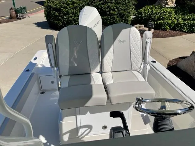 Slide: The Image of 2024 Ranger 2510 Bay boat with dual seats and steering wheel. - 5