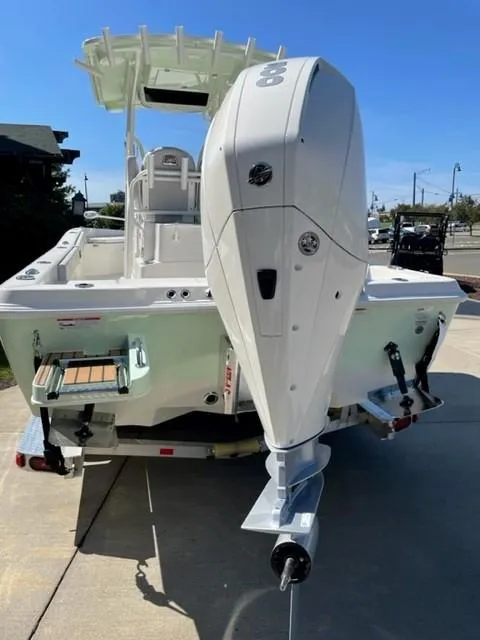 Slide: The Image of 2024 Ranger 2510 Bay boat with outboard motor, rear view. - 6
