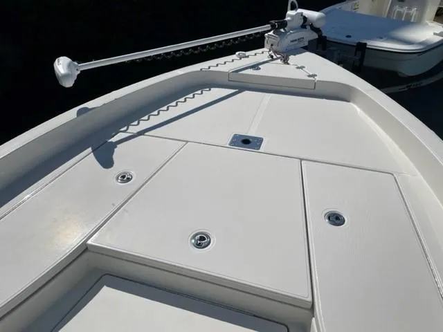 Slide: The Image of 2024 Ranger 2510 Bay boat deck with storage compartments and trolling motor. - 9