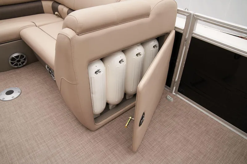 Slide: The Image of 2024 Sun Tracker SportFish 22 DLX boat with storage compartment open. - 25