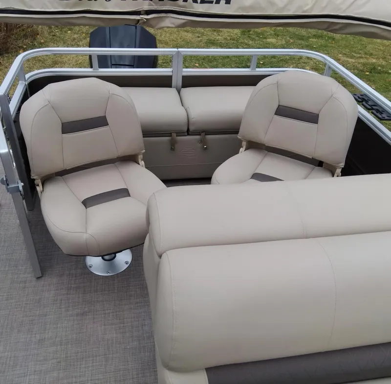 Slide: The Image of 2024 Sun Tracker SportFish 22 XP3 boat interior with beige seating. - 7
