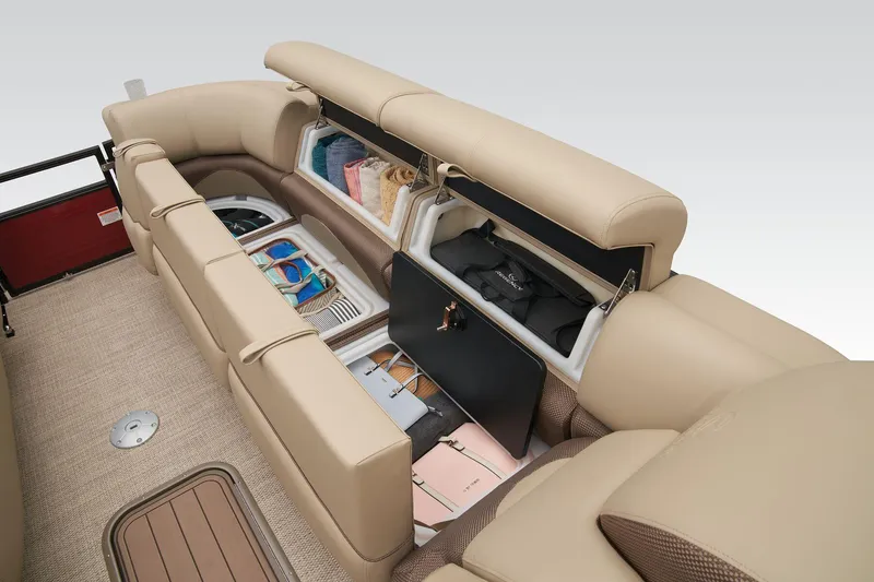 Slide: The Image of 2024 Regency 250 DL3 boat interior storage compartments with beige seating. - 18