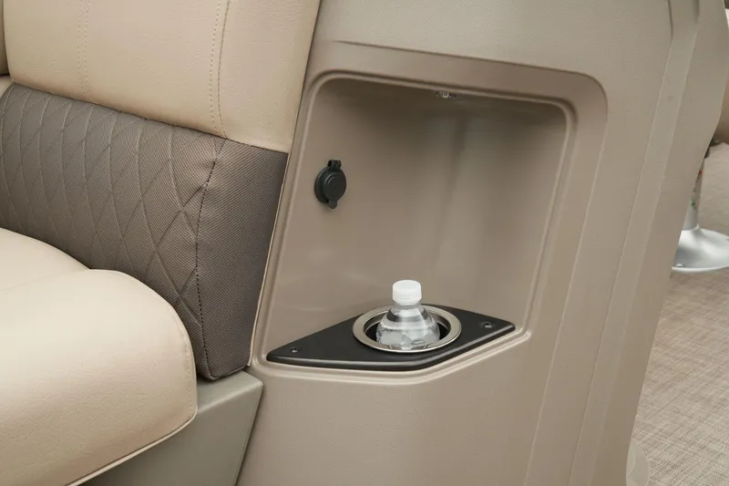 Slide: The Image of 2024 Sun Tracker SportFish 22 XP3 boat interior with cup holder and storage compartment. - 27