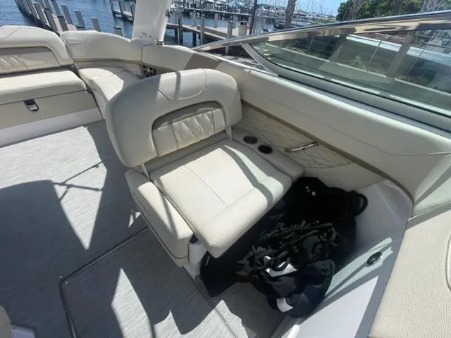Slide: The Image of 2016 Regal 26 Fastdeck boat interior with beige seating and waterfront view. - 12